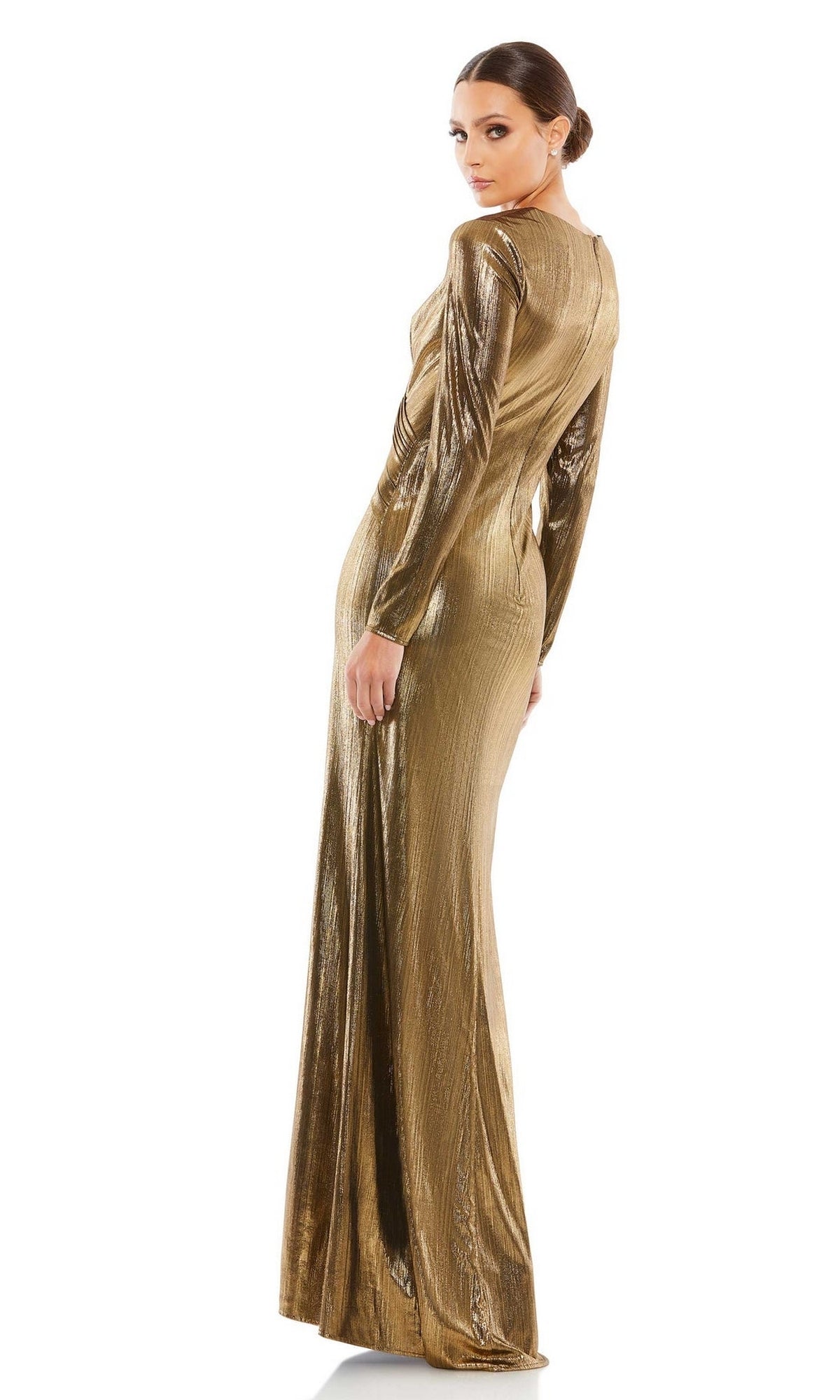 A woman in the Long Sleeve Gold Formal Gown: Mac Duggal 26684 stands with her back turned, glancing over her shoulder.
